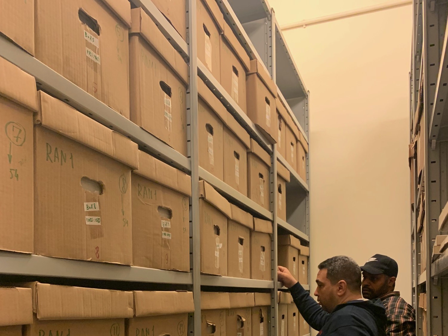 records management staff with records boxes and shelves