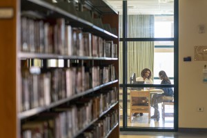 two students studying in the library building